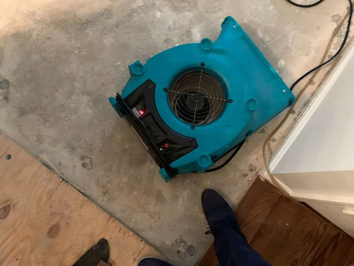 Air mover drying subfloor during Commercial Water Damage Restoration in Fort Lauderdale